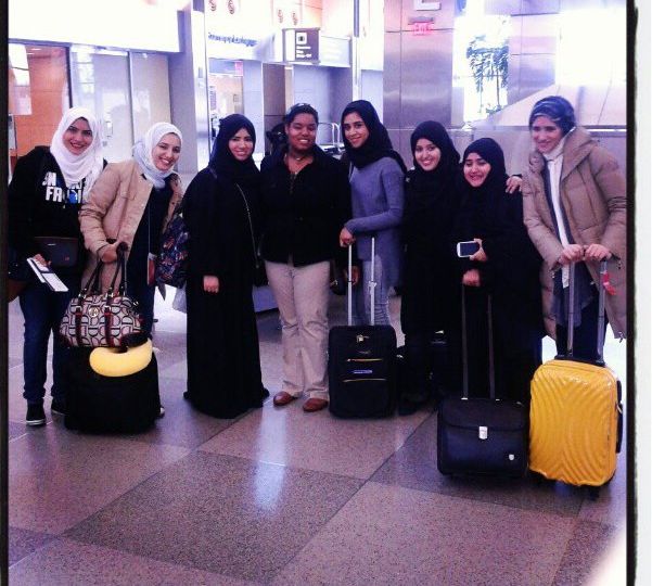 Group of Qatari students with their baggage.