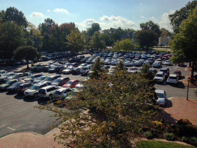 wide shot of WPU parking lot packed full outside of Flowe building