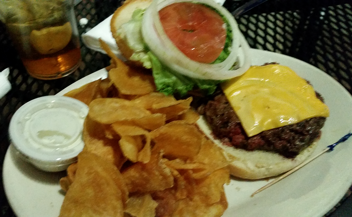 cheeseburger and chips on a plate