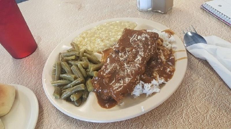Plate of Country fried steak with green beans